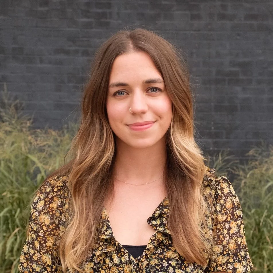 Lauren Little, therapist, in her office with notebook